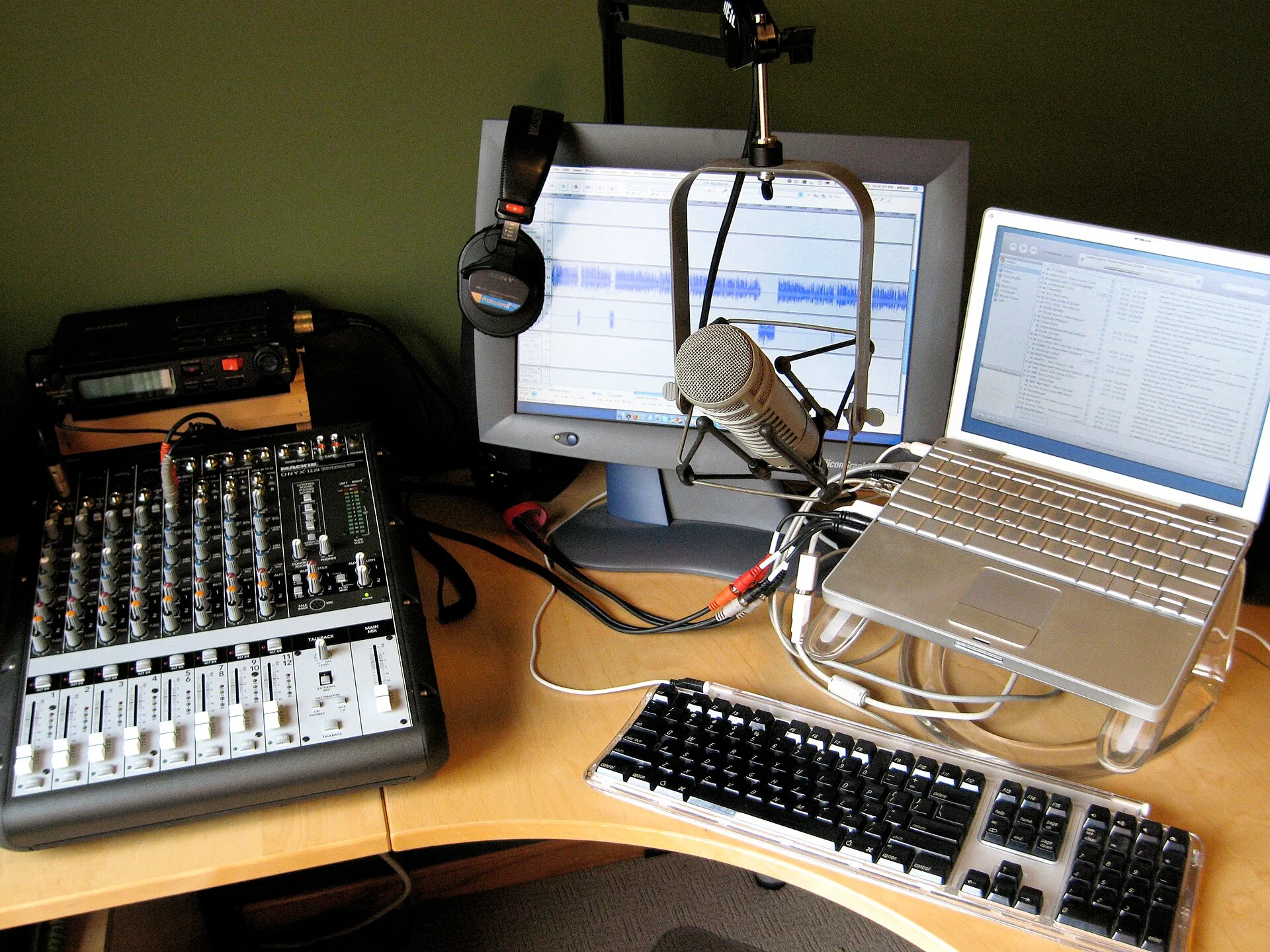 I bought some new gear so I thought a photo update of the "podcave" was in order. Marantz PMD670 solid state recorder (about $600 from eBay) with a 2-GB compact flash card. Mackie Onyx 1220 mixer (about $400 from eBay). This is a great mixer which is small enough to be mobile if necessary. Sony MDR-