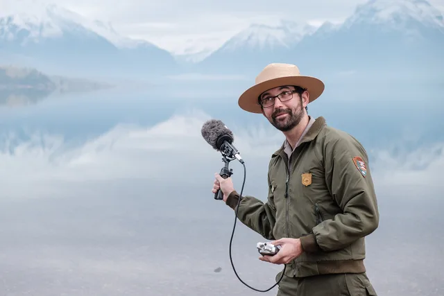 Headwaters Podcast host Michael Faist recording audio of Lake McDonald with a shotgun mic. What podcast SEO competitor research means for UK show discovery