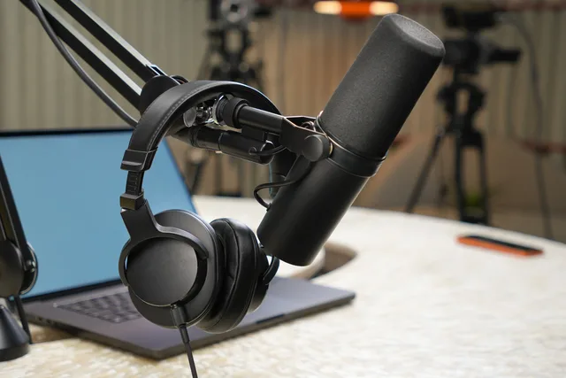 Close-up of a podcast studio setup featuring a microphone and headphones. Podcast SEO supplier due diligence checklist