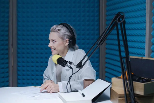 Woman wearing headphones recording a podcast in a soundproof studio with a microphone. Budget for podcast SEO software selection with a clear checklist