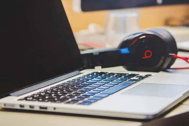 macbook, laptop, computer, technology, business, office, desk, beats, headphones, beats, headphones, headphones, headphones, headphones, headphones. When to plan a podcast SEO strategy and how to sequence the first ninety days