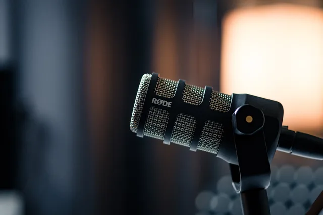 Close-up of a Rode microphone in a studio, emphasizing professional audio equipment. Choosing a podcast SEO supplier comparison without agency spin